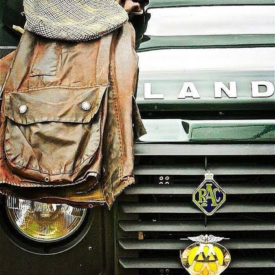 Waxed jacket and tweed cap on a Land Rover grille