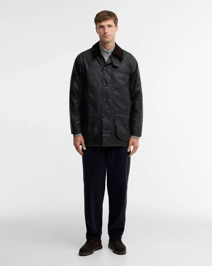 Man wearing the Barbour Border Waxed Jacket in Sage