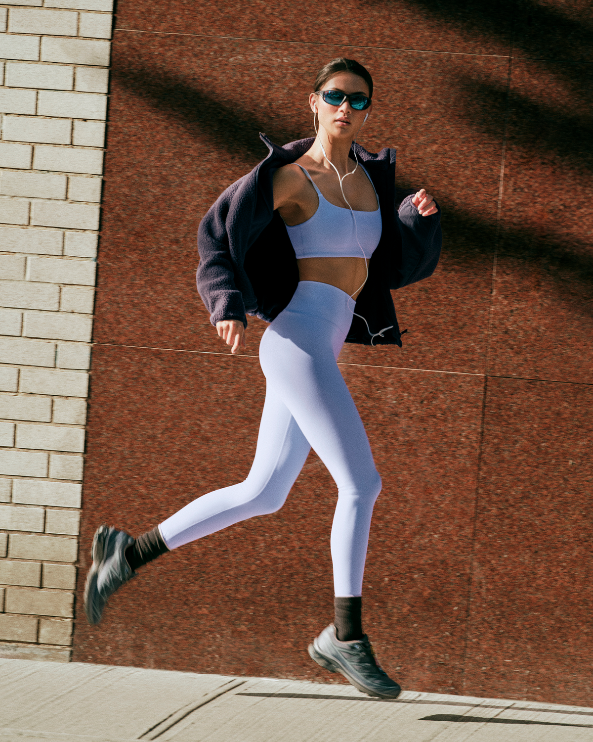 Woman running in New York in Vuori